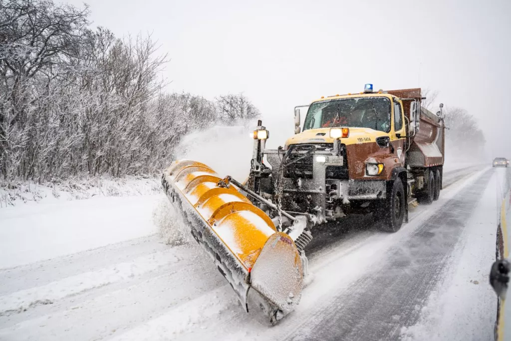 Snow remover on a snowy lane