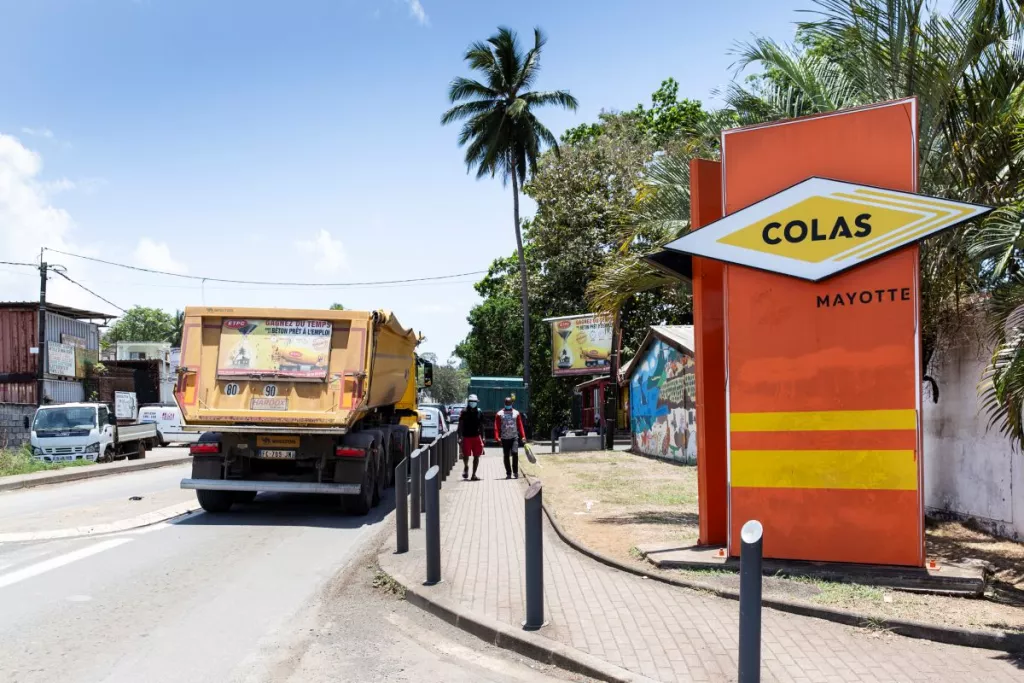 City with truck and Colas Mayotte sign