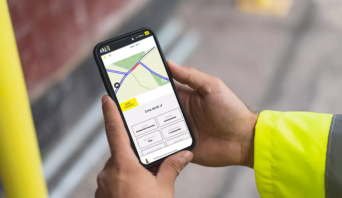 Hands holding a phone with a map displayed