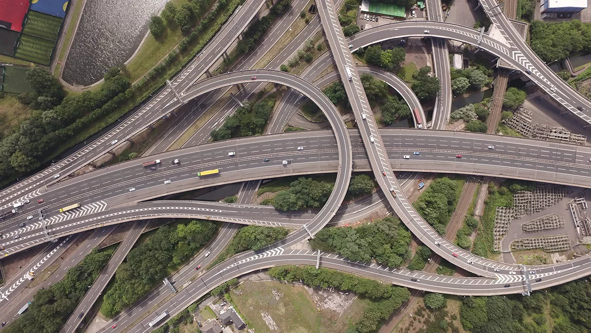 Aerial view of a large motorway junction with several intersecting roads.