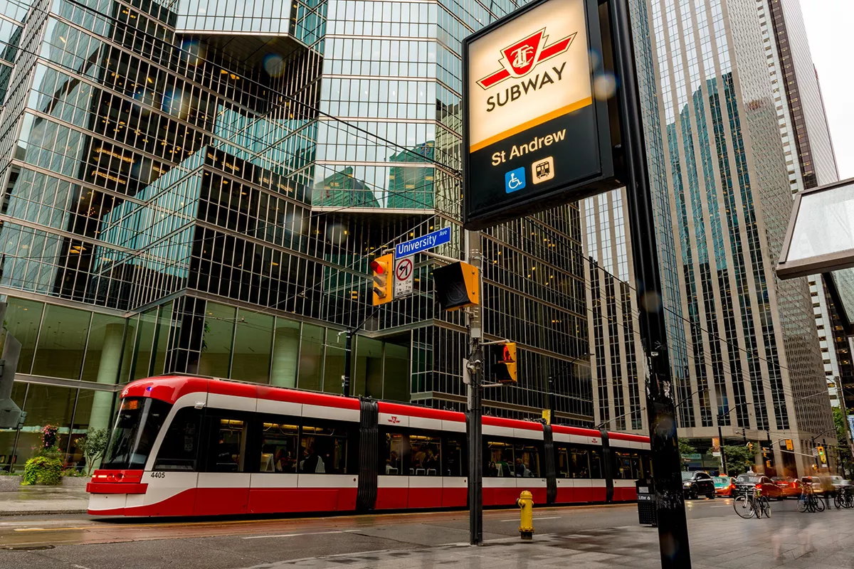 Urban scene with public transport, a tram and modern architecture