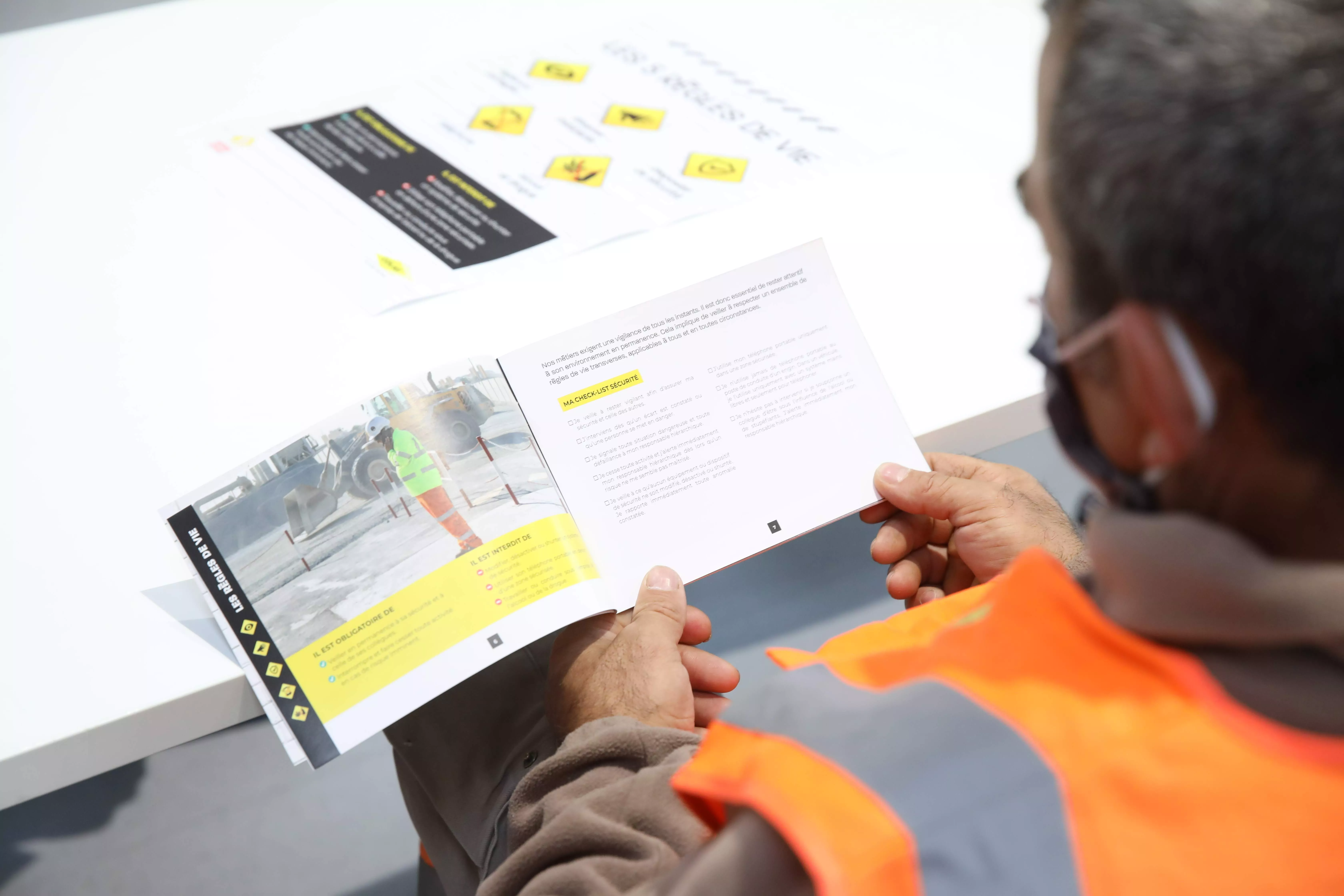 Man observing a leaflet about security